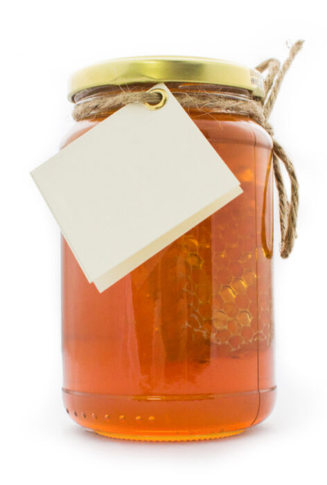 Honey Jar with Honeycomb Honey jar filled with honey and a honeycomb